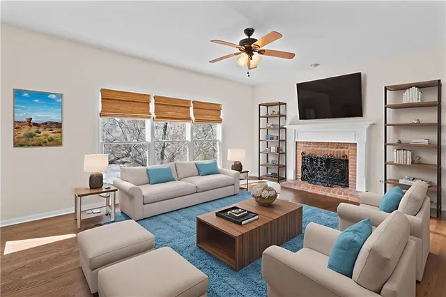 a living room with furniture fireplace and a flat screen tv