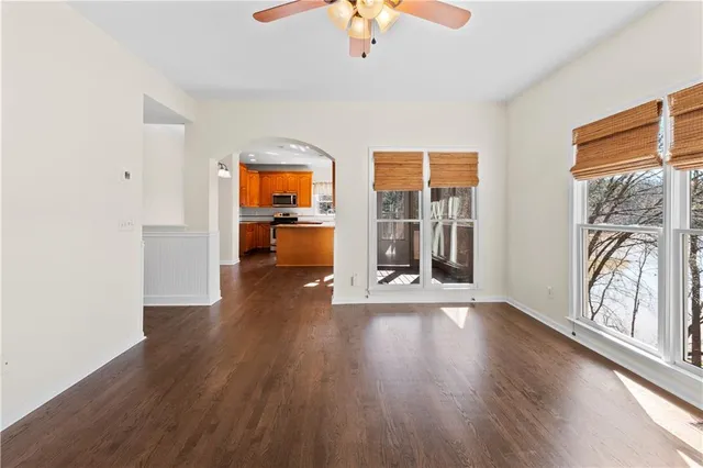 a kitchen with stainless steel appliances granite countertop a refrigerator a stove and a sink