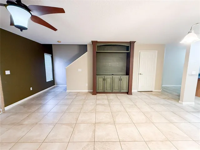 a view of a livingroom with a staircase