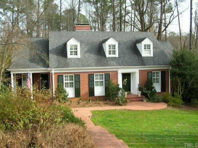 2818 Exeter Circle Raleigh, NC 27608 - Photo 1 of 10 Lovely brick home in Budleigh nestled on one acre lot inside the beltline. Exterior Front
