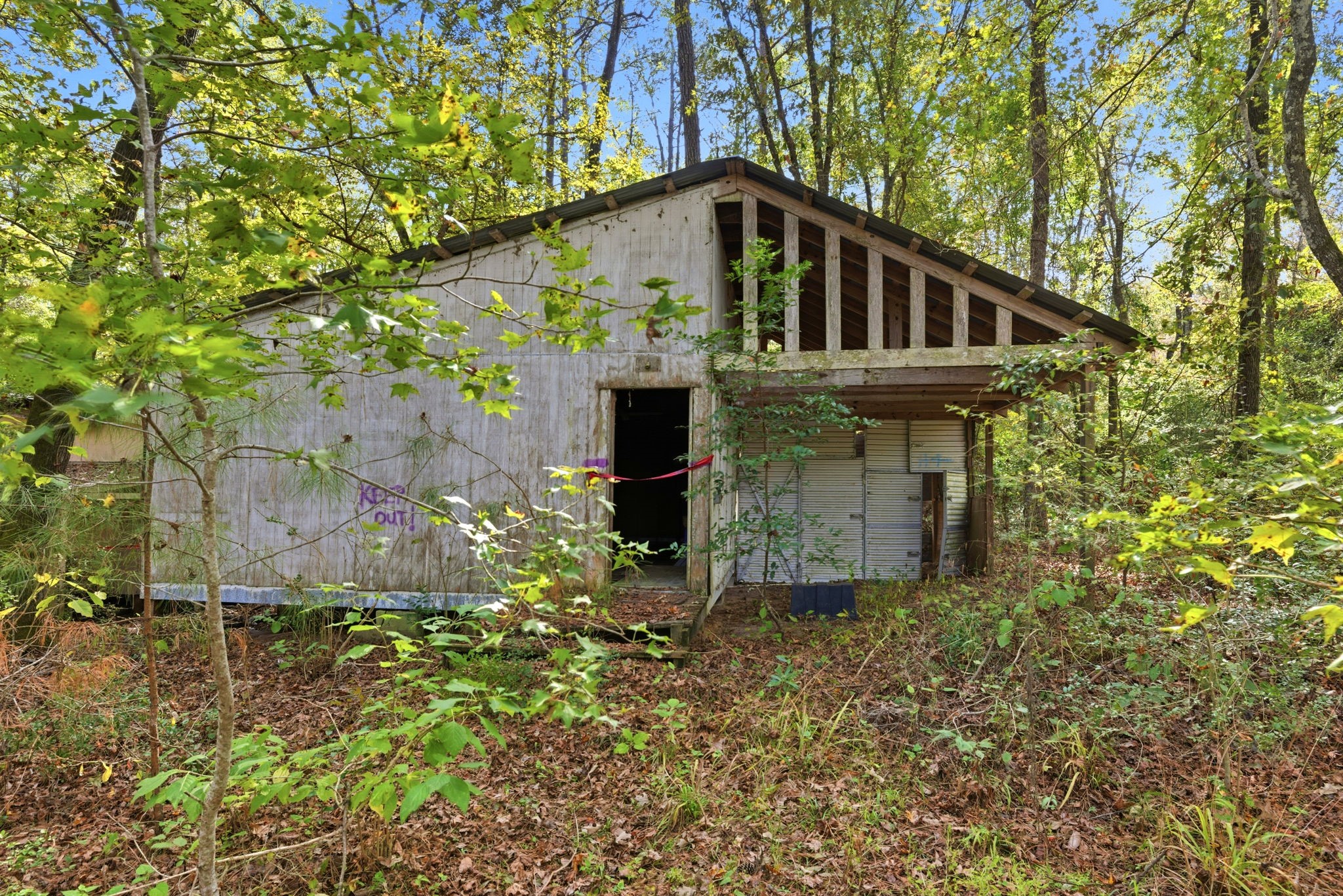 11091 Newton Circle Conroe, TX 77303 - Photo 7 of 13 a view of a small house with a small yard and large tree