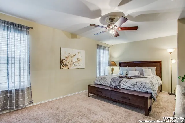 a bedroom with bed and window