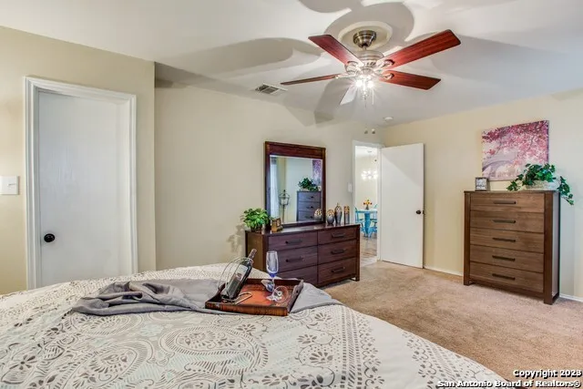 a bed room with a bed and a dresser