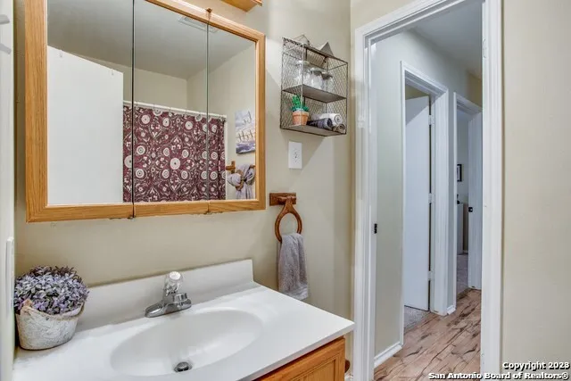 a bathroom with a sink and a mirror