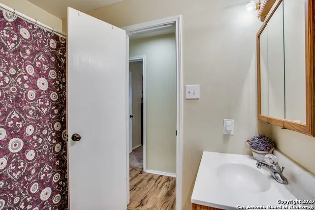 a bathroom with a sink and a mirror
