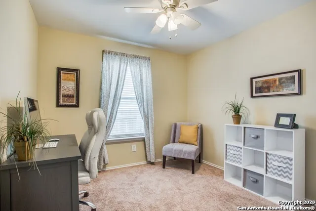 a view of living room filled with furniture and window