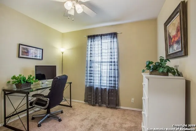 a workspace with furniture and a window