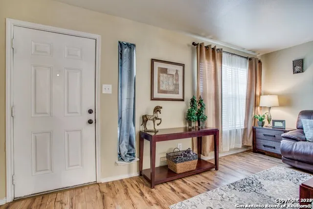a bedroom with furniture and a window