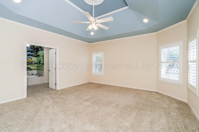 a bathroom with a granite countertop sink a mirror and a shower