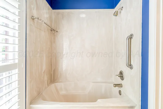 a view of a house with a snow in the yard