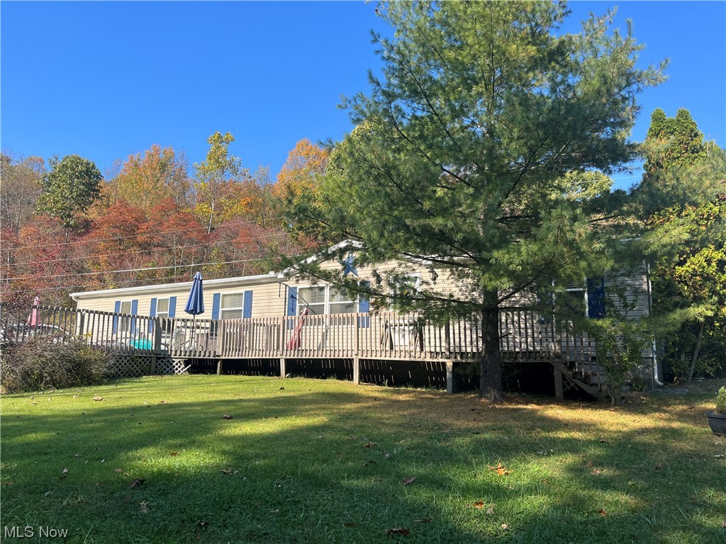 2885 Virginia Ridge Road Philo, OH 43771 - Photo 3 of 23 Rear view of house with a deck and a yard
