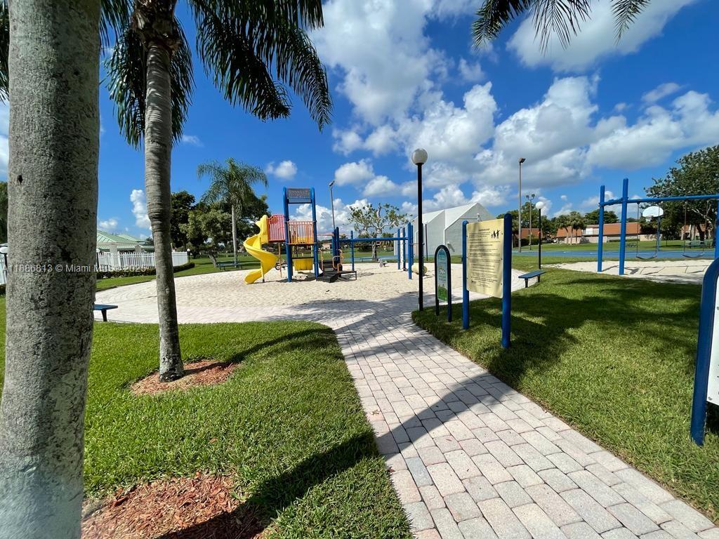 1683 Southwest 109th Terrace Davie, FL 33324 - Photo 12 of 45 a view of a park with swings and slides