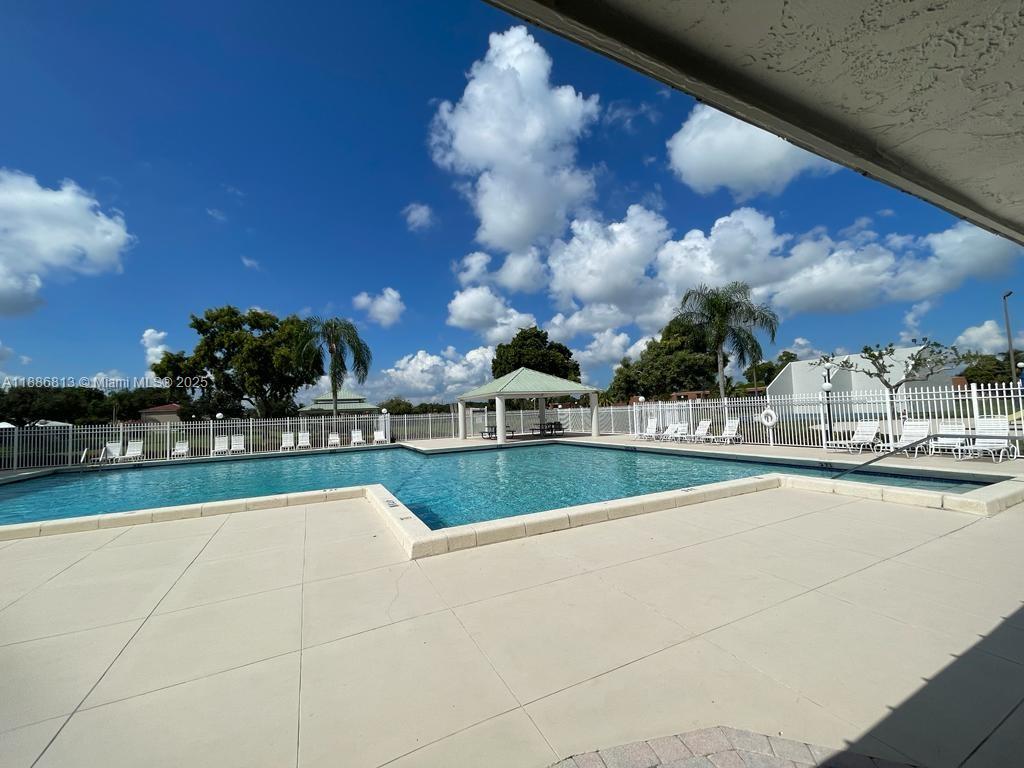1683 Southwest 109th Terrace Davie, FL 33324 - Photo 14 of 45 a view of a swimming pool and outdoor space