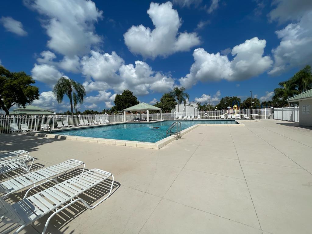 1683 Southwest 109th Terrace Davie, FL 33324 - Photo 15 of 45 a view of a swimming pool with sitting area
