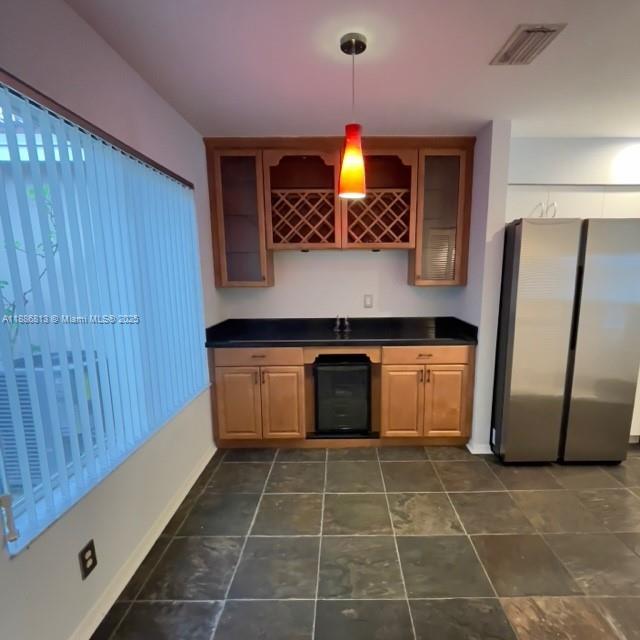 1683 Southwest 109th Terrace Davie, FL 33324 - Photo 24 of 45 a kitchen with a stove a sink and a refrigerator