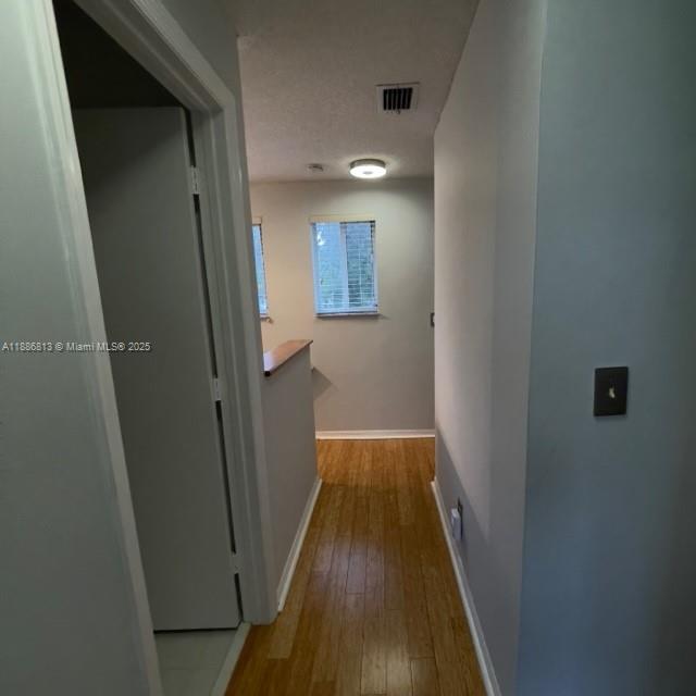 1683 Southwest 109th Terrace Davie, FL 33324 - Photo 25 of 45 a view of a hallway with wooden floor