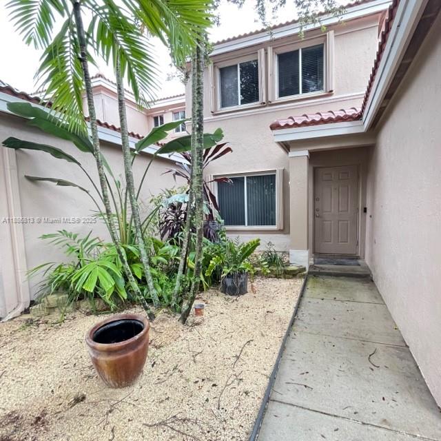 1683 Southwest 109th Terrace Davie, FL 33324 - Photo 3 of 45 a front view of a house with plants