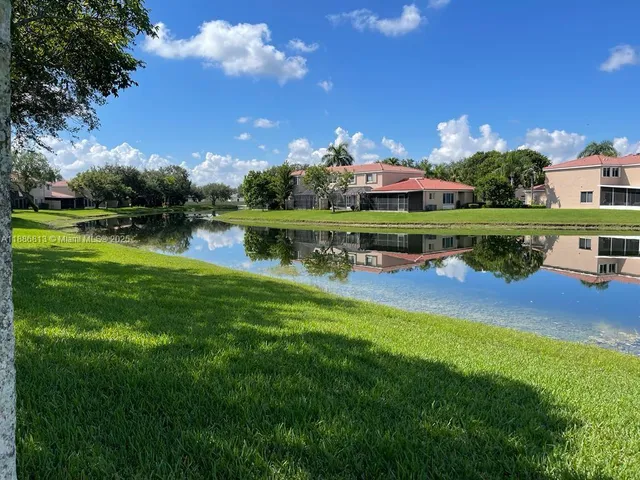a view of a lake with a yard