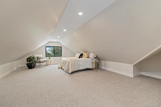 a bed room with a bed and a couch