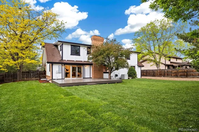 a view of a house with a yard porch and sitting area
