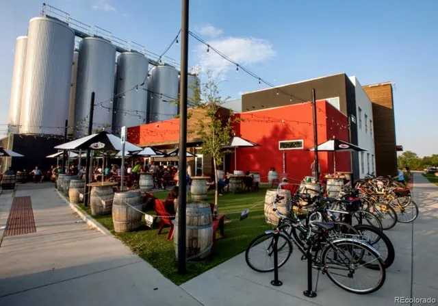 a group of people sitting in front of a building