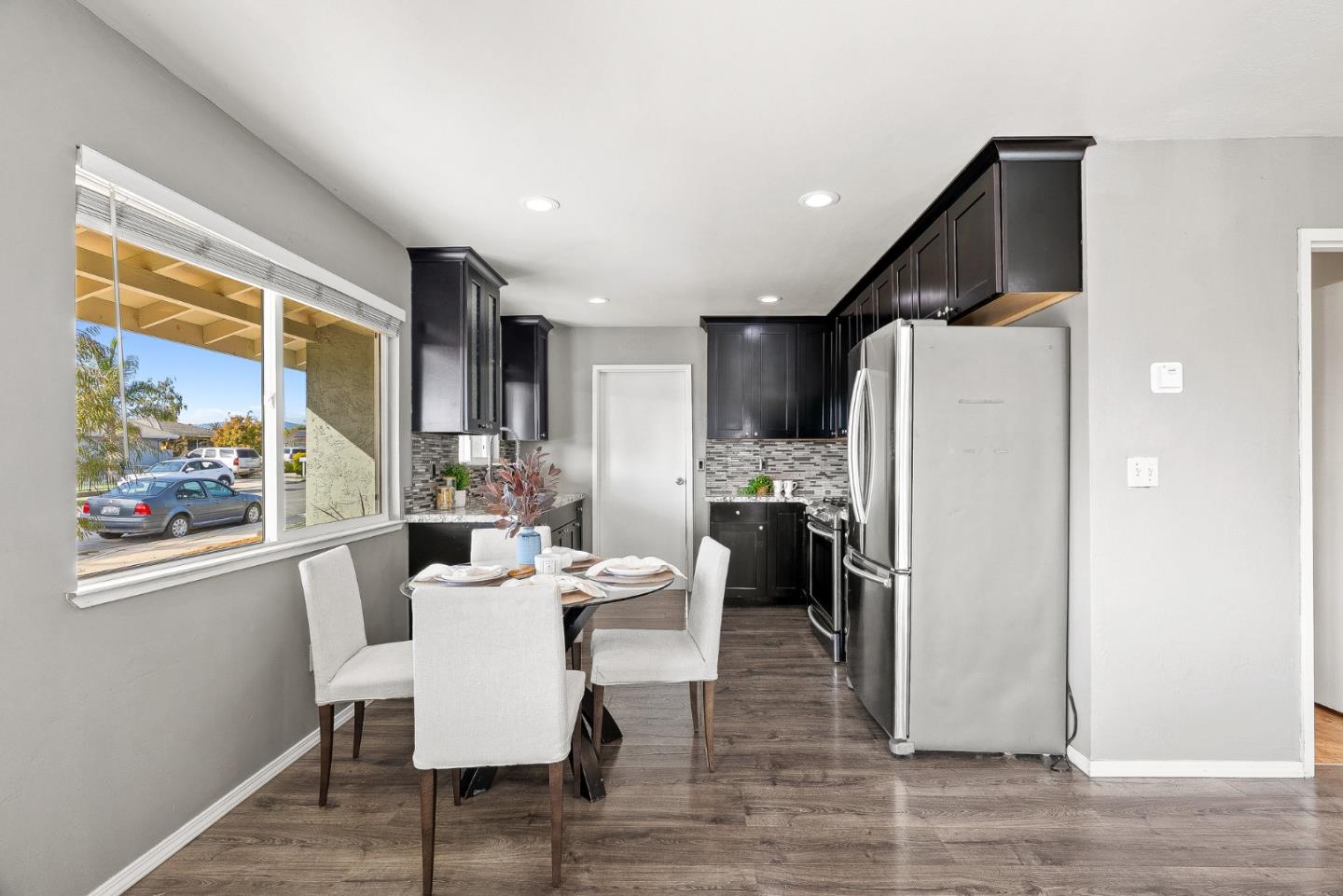 116 Lester Court Watsonville, CA 95076 - Photo 12 of 47 a dining room with furniture a window and a kitchen view