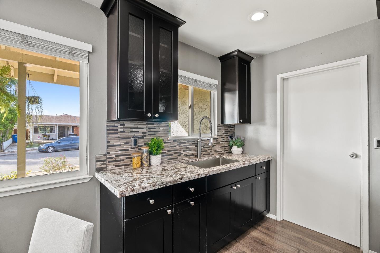 116 Lester Court Watsonville, CA 95076 - Photo 14 of 47 a bathroom with a granite countertop sink and a mirror