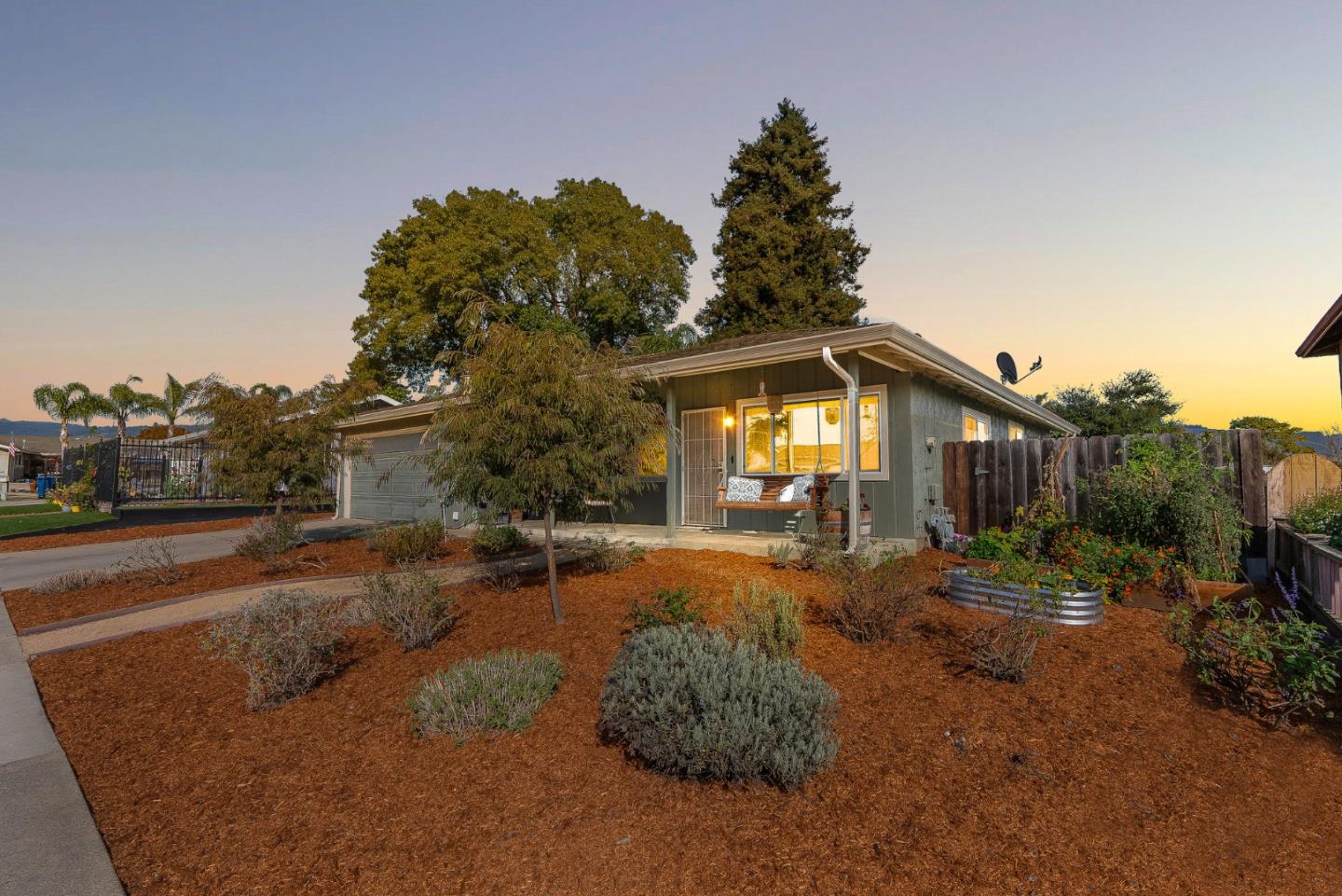 116 Lester Court Watsonville, CA 95076 - Photo 2 of 47 a view of a house with a yard and garage