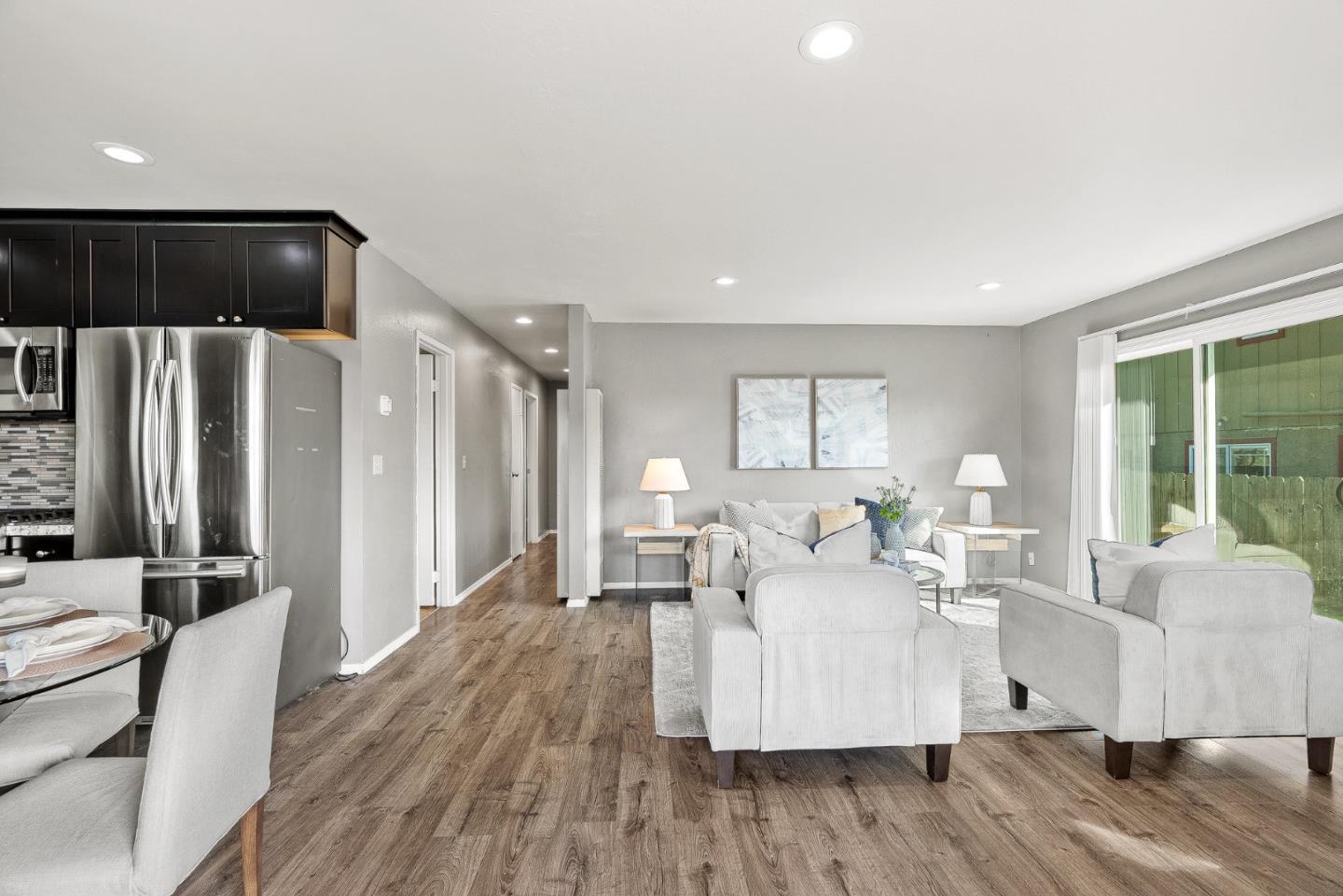 116 Lester Court Watsonville, CA 95076 - Photo 8 of 47 a living room with furniture wooden floor and a large window