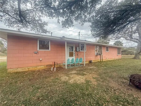 a backyard of a house with seating space