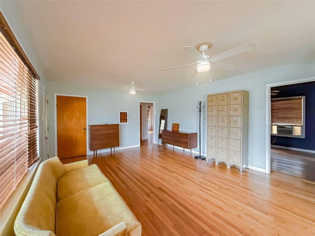 729 Main Street Lexington, TX 78947 - Photo 2 of 15 Living room featuring a ceiling fan and light wood-style flooring