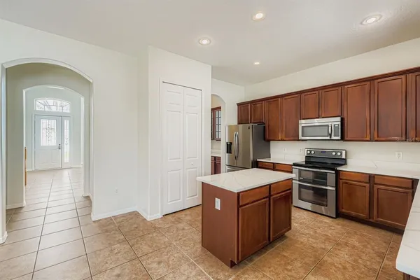 a kitchen with a cabinets and steel stainless steel appliances