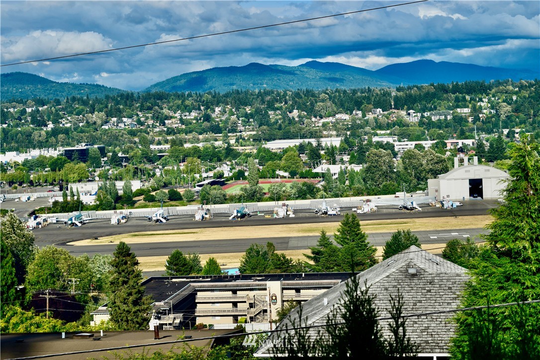 357 Lind Avenue Northwest Renton, WA 98057 - Photo 1 of 27 a view of a city with a lake