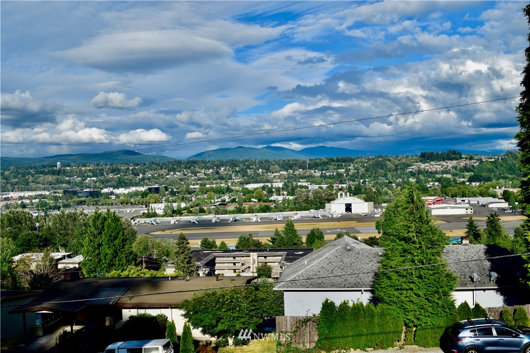357 Lind Avenue Northwest Renton, WA 98057 - Photo 2 of 27 an aerial view of residential building and car parked