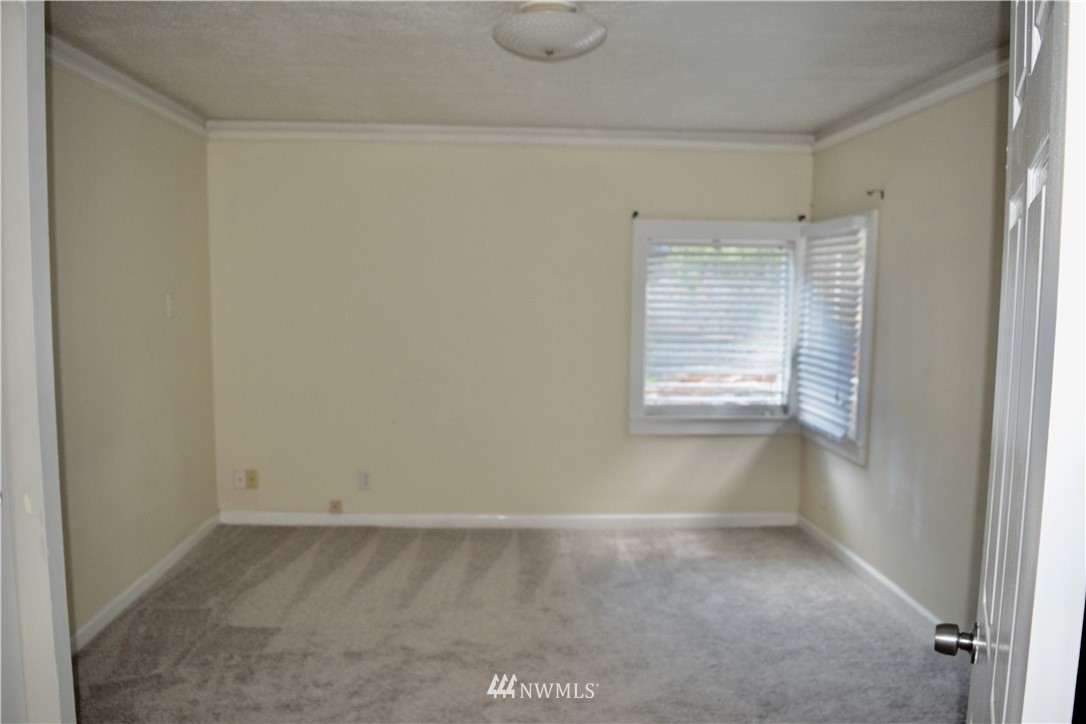 357 Lind Avenue Northwest Renton, WA 98057 - Photo 14 of 27 a view of an empty room with a window