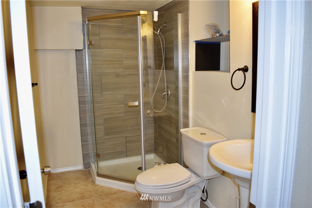 357 Lind Avenue Northwest Renton, WA 98057 - Photo 22 of 27 a bathroom with a toilet and shower