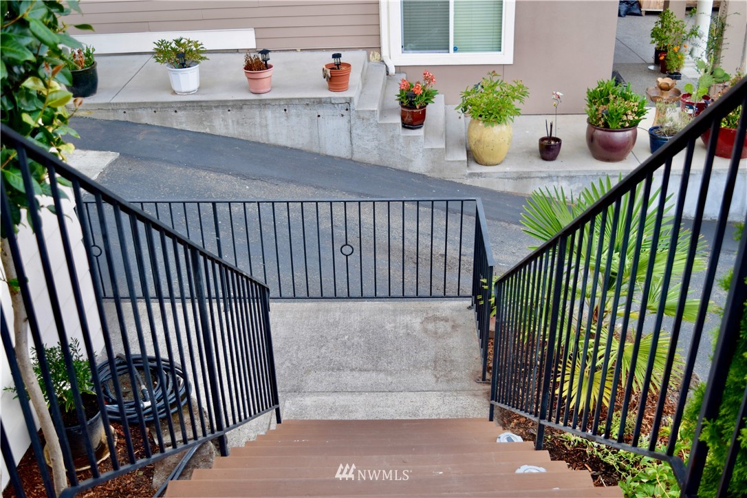 357 Lind Avenue Northwest Renton, WA 98057 - Photo 7 of 27 a side view of a house with potted plants