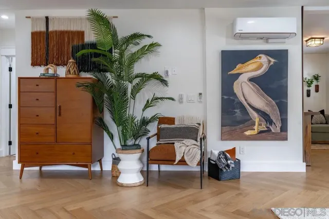 a living room with furniture fireplace and potted plants