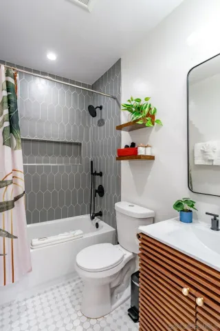 a view of a patio with couches and potted plants