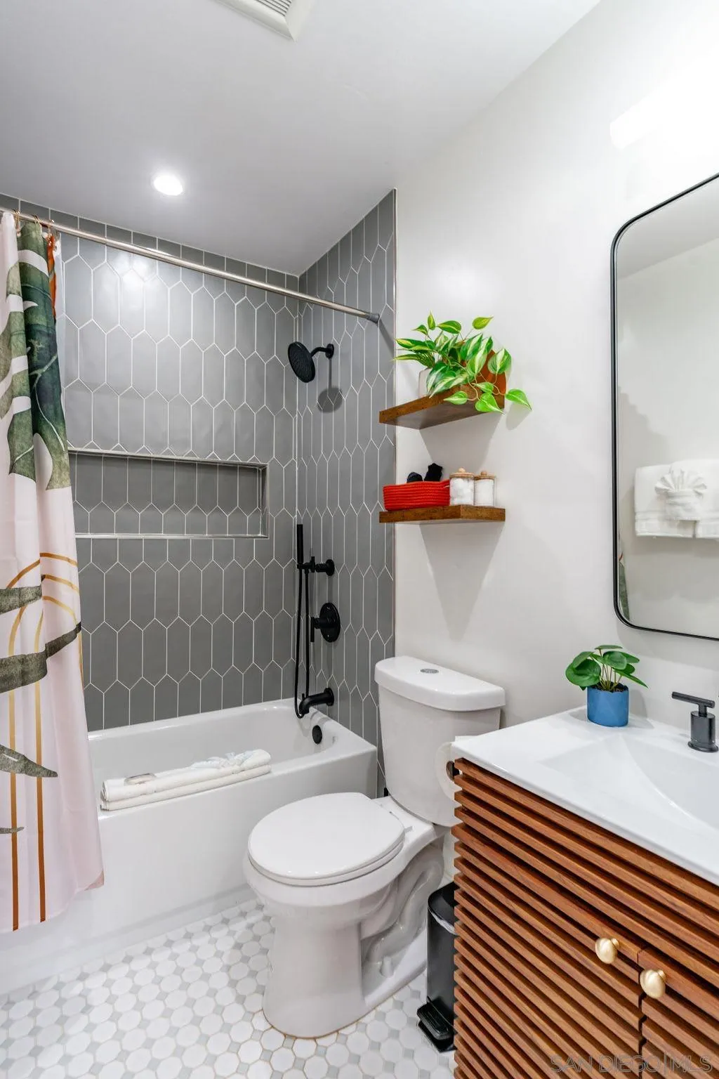 725 Pennsylvania Avenue San Diego, CA 92103 - Photo 35 of 64 a bathroom with a sink toilet and shower