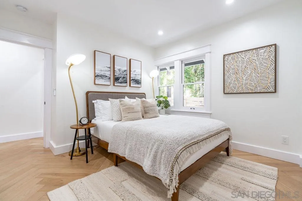 725 Pennsylvania Avenue San Diego, CA 92103 - Photo 37 of 64 a bedroom with a bed and a night stand