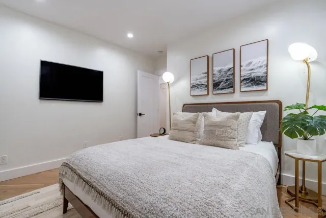 a bedroom with bed and window