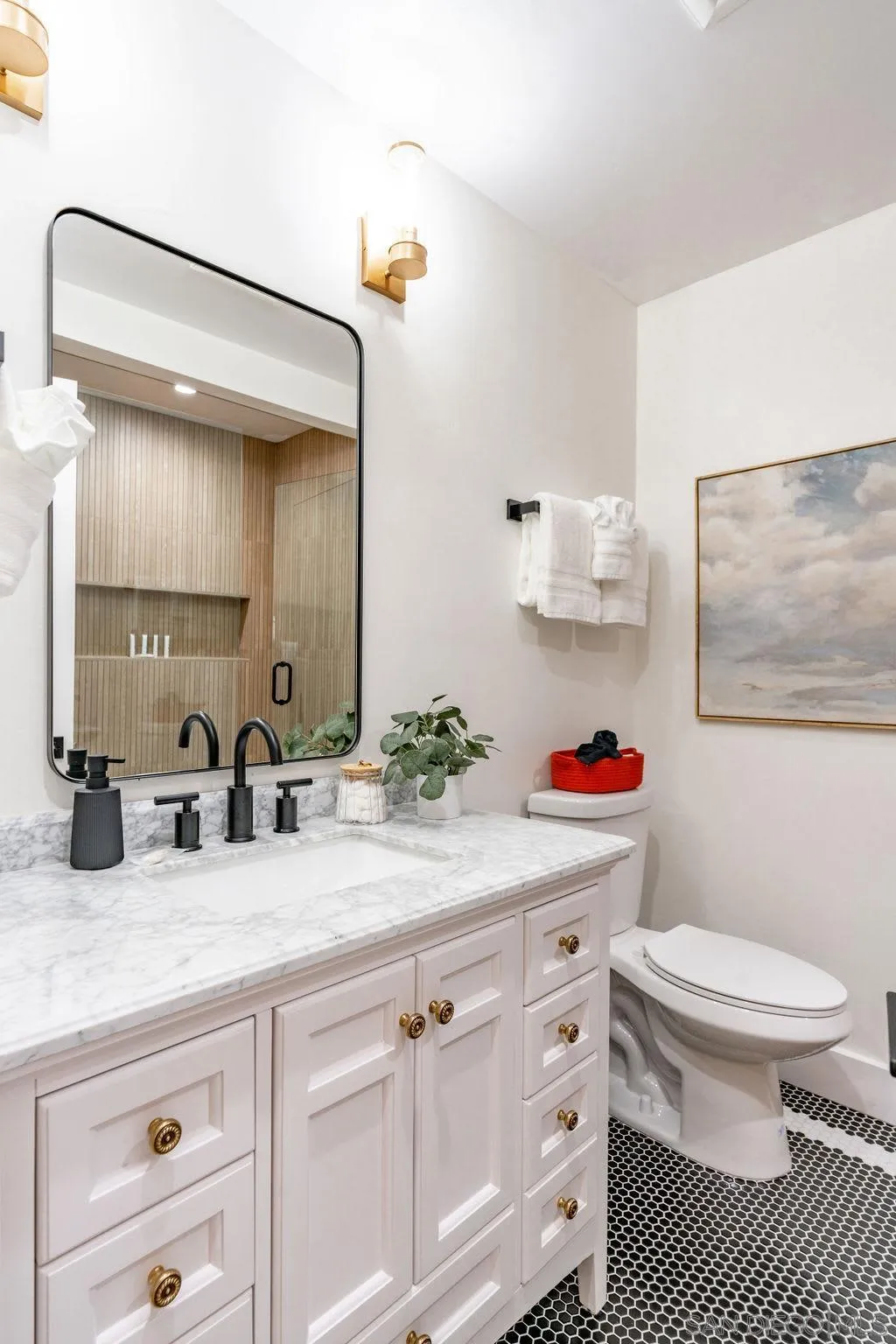 725 Pennsylvania Avenue San Diego, CA 92103 - Photo 39 of 64 a bathroom with a sink a toilet and a mirror