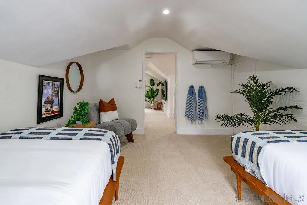 725 Pennsylvania Avenue San Diego, CA 92103 - Photo 52 of 64 a bedroom with bed and a potted plant