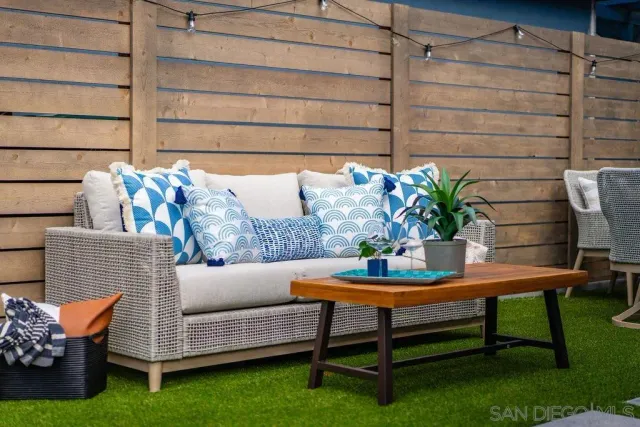 a view of a chairs and table in patio