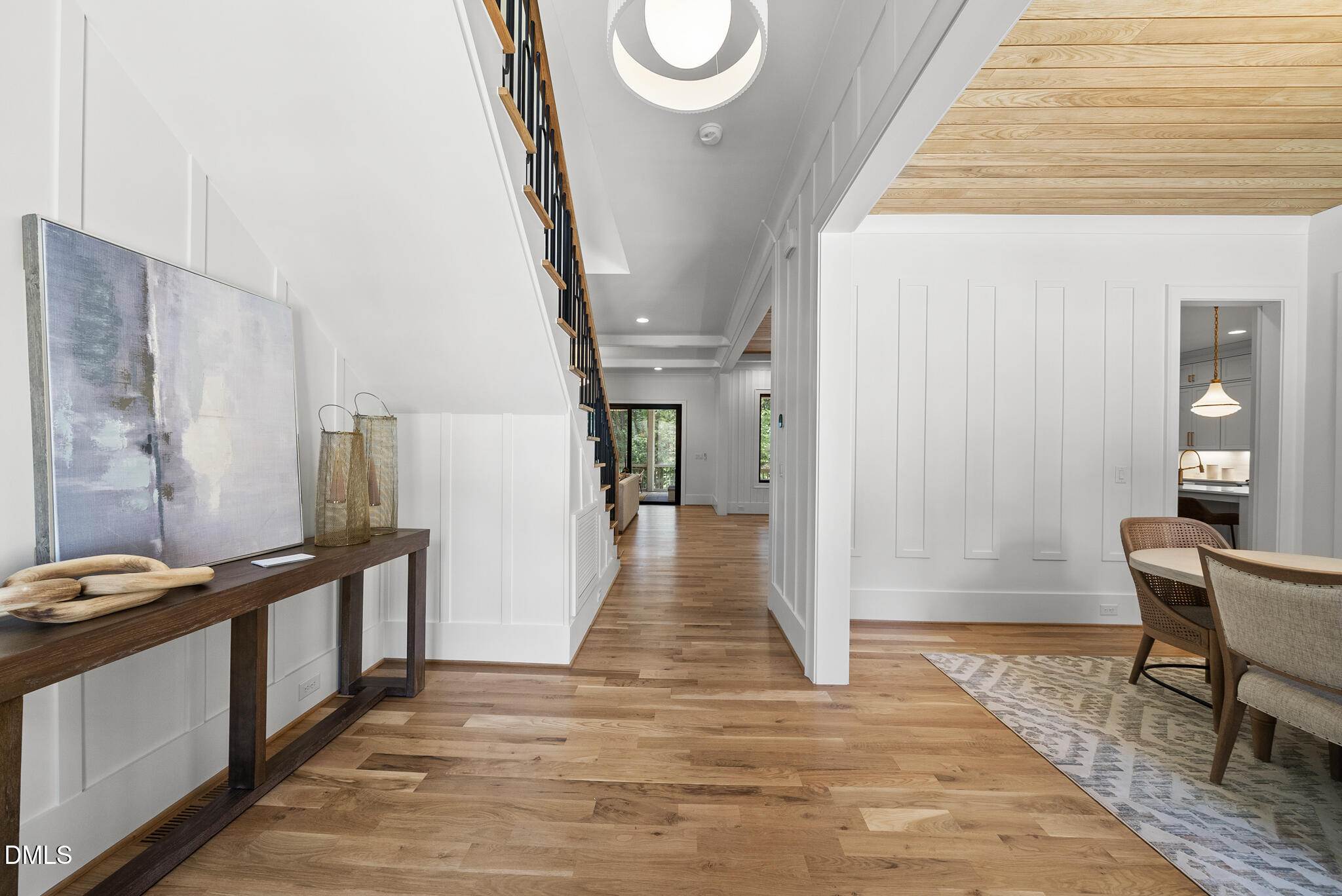 1609 Ridge Road Raleigh, NC 27607 - Photo 3 of 62 a view of a hallway with wooden floor and staircase