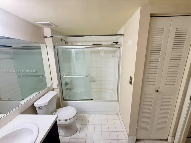 a bathroom with a shower and a toilet