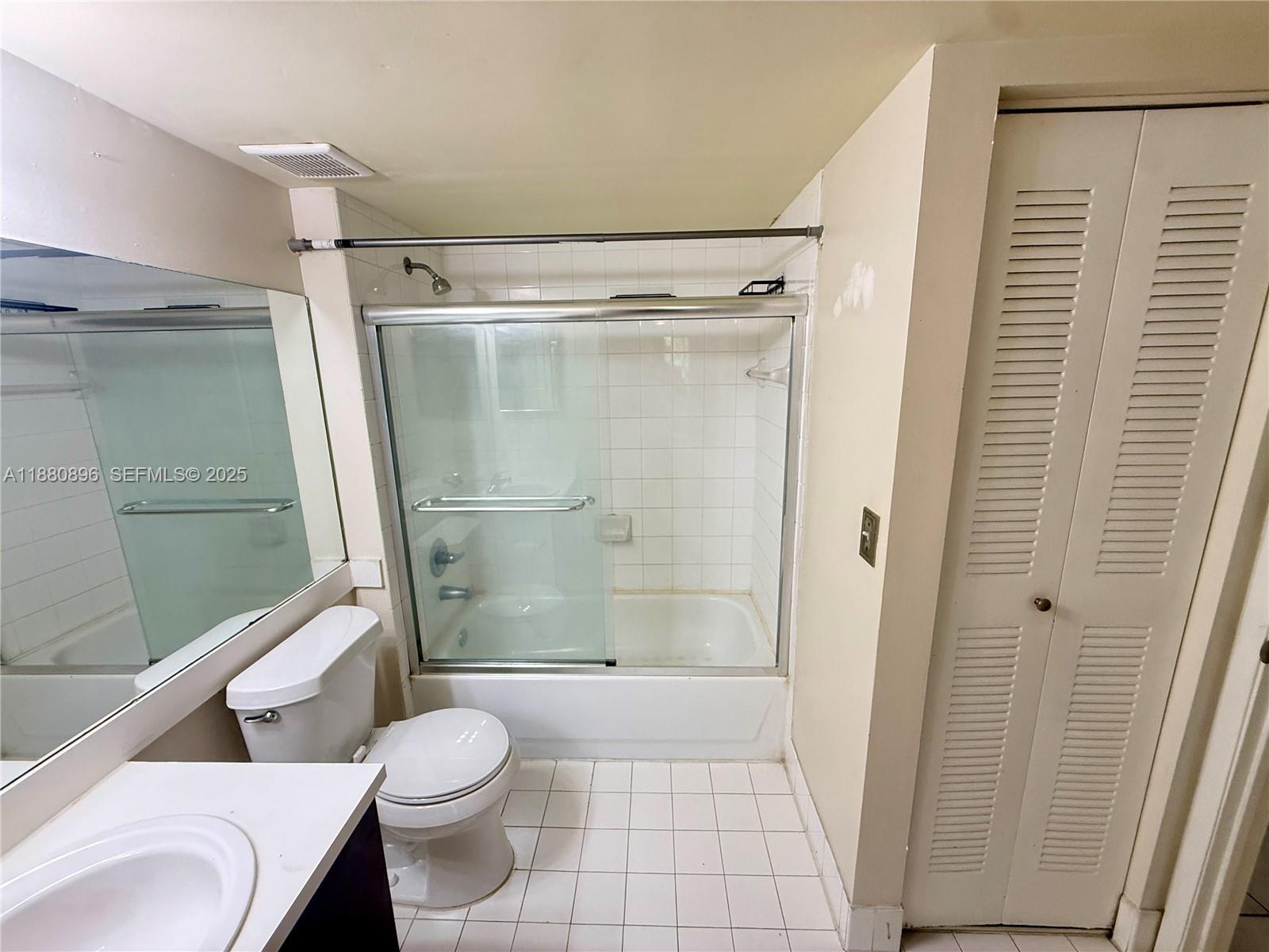 3870 Lyons Road, Unit 2108 Coconut Creek, FL 33073 - Photo 8 of 19 a bathroom with a shower and a toilet