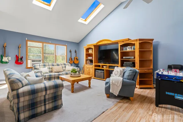 a living room with furniture fireplace and a flat screen tv