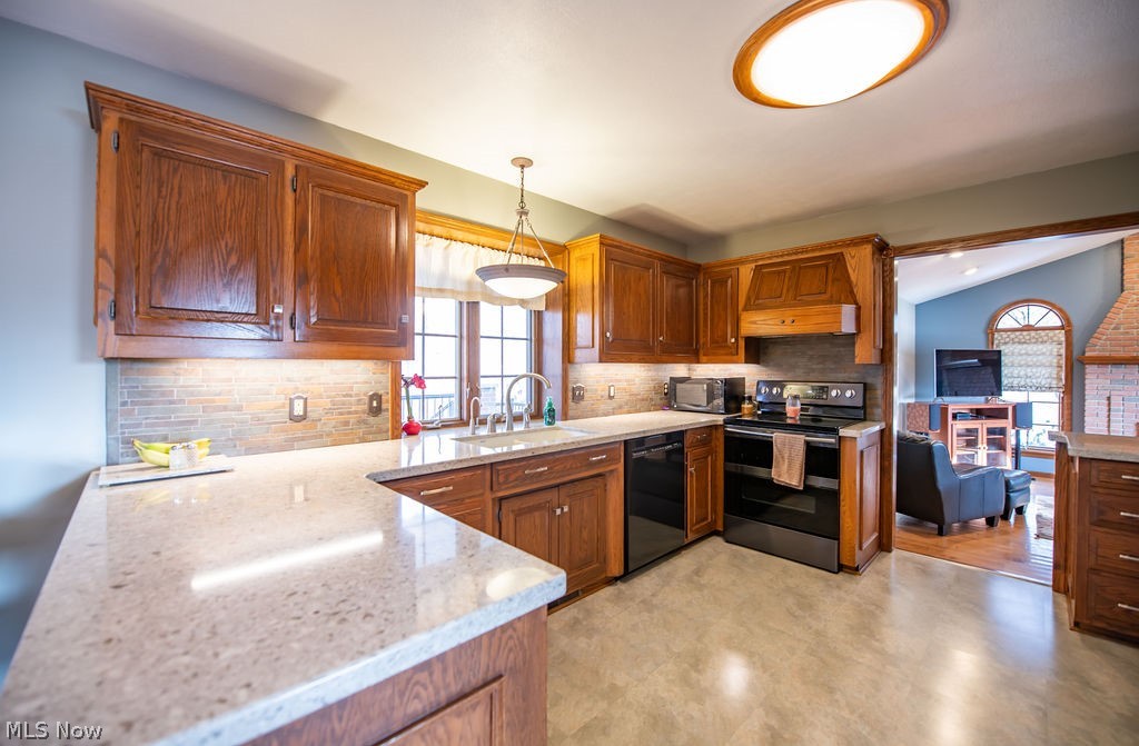 4848 Fette Road Dennison, OH 44621 - Photo 21 of 48 Kitchen with appliances, spacious countertops, and wood cabinetry